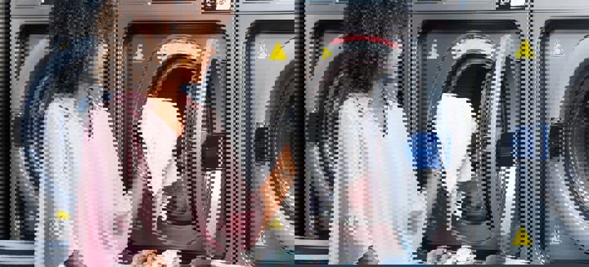 Woman Loading Washing Machine At Laundromat Min