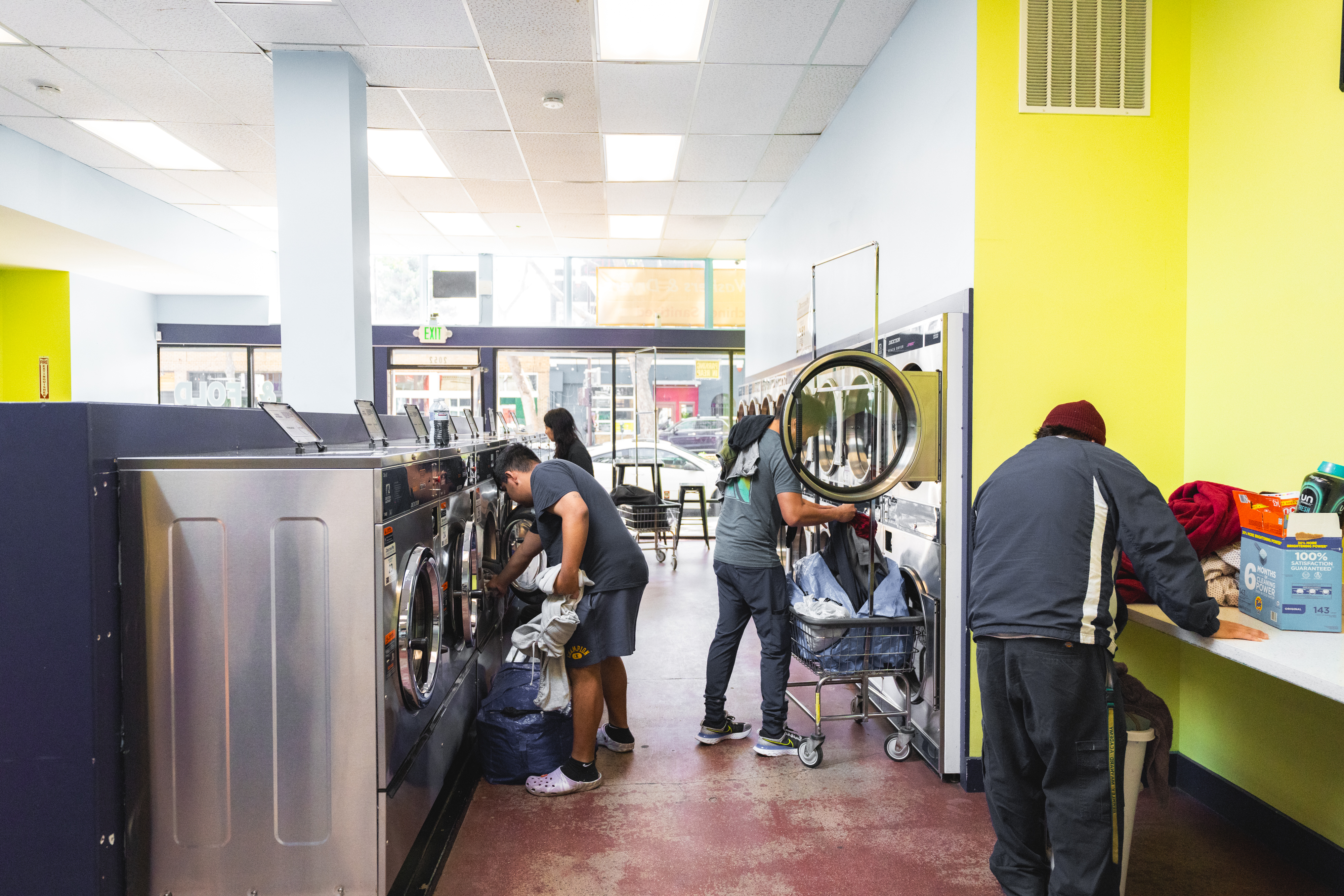 Multiple Customers Loading Washers Front